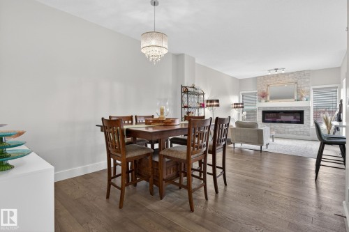 94 Tribute Common, Spruce Grove, AB - Indoor Photo Showing Dining Room With Fireplace