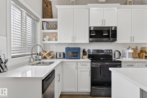 94 Tribute Common, Spruce Grove, AB - Indoor Photo Showing Kitchen With Double Sink