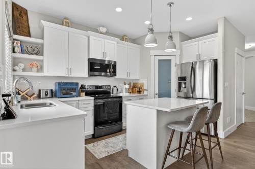 94 Tribute Common, Spruce Grove, AB - Indoor Photo Showing Kitchen With Stainless Steel Kitchen With Double Sink With Upgraded Kitchen
