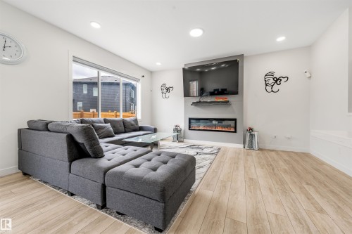 2629 15A Avenue, Edmonton, AB - Indoor Photo Showing Living Room With Fireplace