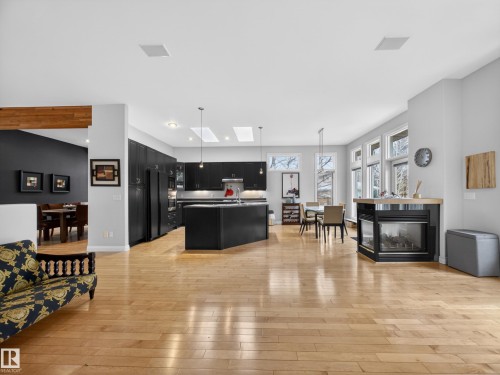 Spacious open-concept living area featuring blonde wood-finish flooring - 569 Butterworth Way, Edmonton, AB - Indoor