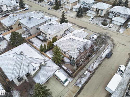 Established neighborhood featuring a collection of properties with pitched roofs, fenced backyards, and mature landscaping - 569 Butterworth Way, Edmonton, AB - Outdoor