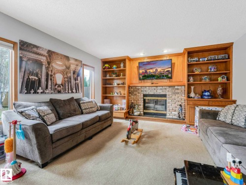 7 Haven, Devon, AB - Indoor Photo Showing Living Room With Fireplace