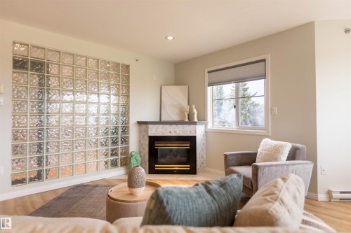 303 20 Grange Drive, St. Albert, AB - Indoor Photo Showing Living Room With Fireplace