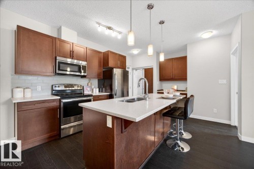 205 507 Albany Way, Edmonton, AB - Indoor Photo Showing Kitchen With Stainless Steel Kitchen With Double Sink With Upgraded Kitchen