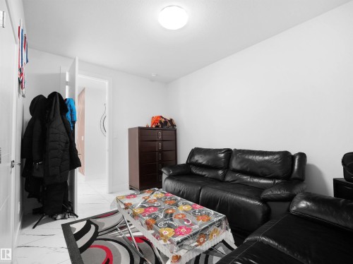 Recessed ceiling light fixture illuminating a room with white walls - 1208 25 St Nw, Edmonton, AB - Indoor Photo Showing Other Room
