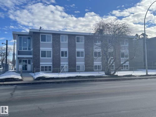 Multi-story residential building featuring a brick and siding exterior - 303 12223 82 Street, Edmonton, AB - Outdoor