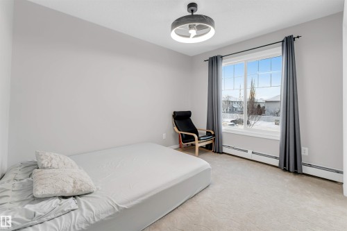 Carpeted room with light grey walls - 201 4403 23 Street, Edmonton, AB - Indoor Photo Showing Bedroom
