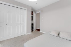 Room featuring light gray painted walls and light-colored carpet flooring - 