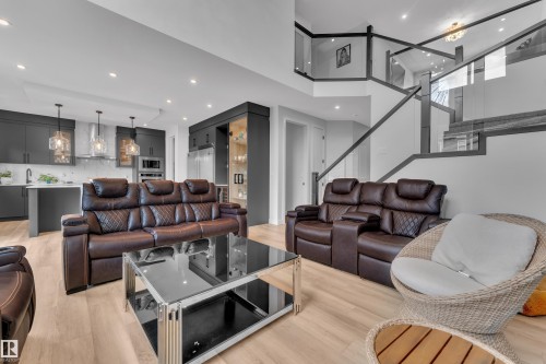 Open-concept living space featuring light wood-finish flooring and recessed lighting - 5722 Kootook Way, Edmonton, AB - Indoor Photo Showing Living Room