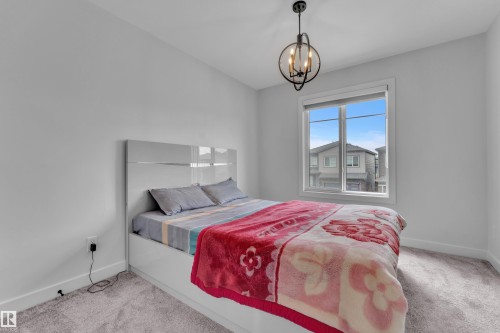 Spacious room featuring light gray walls and plush gray carpeting - 5722 Kootook Way, Edmonton, AB - Indoor Photo Showing Bedroom