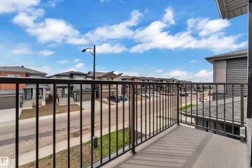 Outdoor balcony featuring dark metal railings and a textured flooring surface - 5722 Kootook Way, Edmonton, AB - Outdoor With Balcony