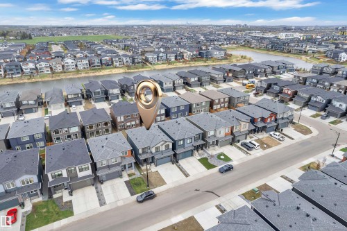 Modern residential neighborhood featuring a variety of detached homes with attached garages - 5722 Kootook Way, Edmonton, AB - Outdoor With View