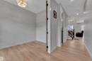 Entryway featuring wood-finish flooring, light grey walls, and white baseboards - 5722 Kootook Way, Edmonton, AB  - Indoor Photo Showing Other Room 