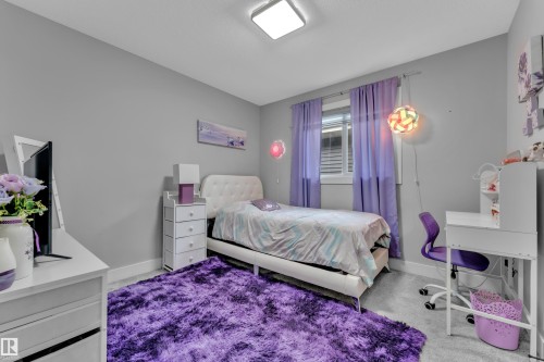 Bedroom featuring soft gray walls and light gray carpet - 8025 174A Avenue, Edmonton, AB - Indoor Photo Showing Bedroom