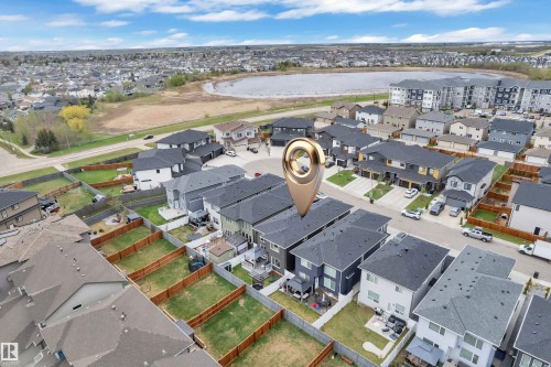 Aerial perspective showcasing a developed residential area with multiple detached and attached properties - 8025 174A Avenue, Edmonton, AB - Outdoor With View