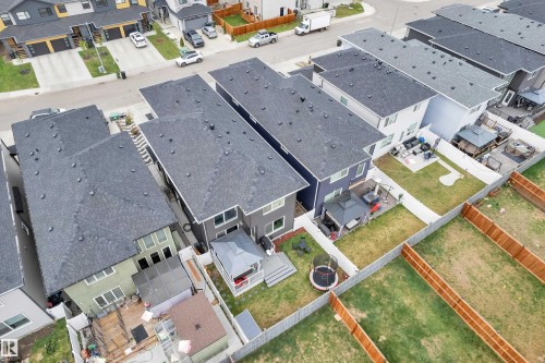 Aerial perspective highlighting multiple properties with fenced backyards - 8025 174A Avenue, Edmonton, AB - 