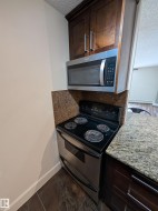 Modern kitchen appliances featuring a stainless steel range and an over-the-range microwave - 