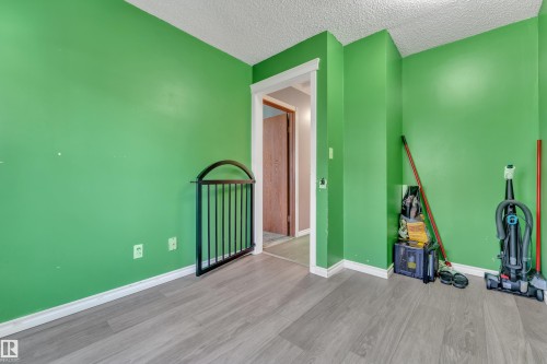 Wood-finish flooring with baseboard trim - 4536 35A Avenue, Edmonton, AB - Indoor
