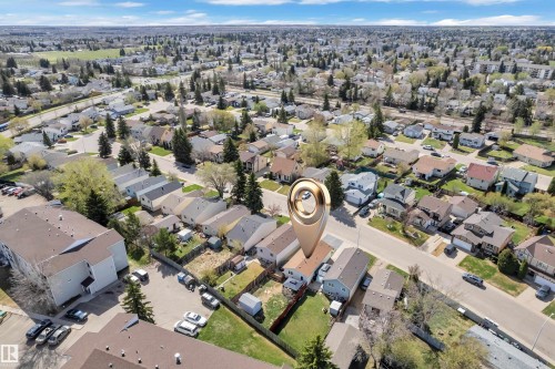 Neighborhood aerial featuring a mix of residential properties with mature trees and paved streets - 4536 35A Avenue, Edmonton, AB - Outdoor With View