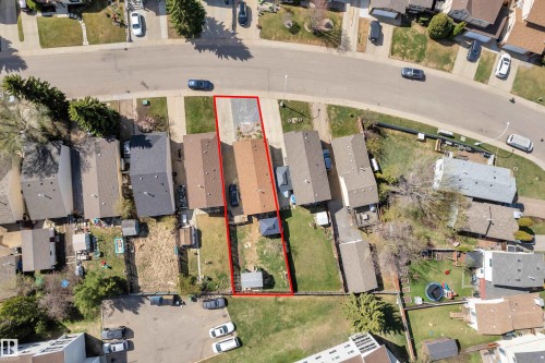 Overhead perspective showcasing a residential property with a detached home, extended driveway, and private backyard space - 4536 35A Avenue, Edmonton, AB - Outdoor With View