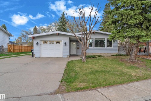 Single-story residence featuring light blue siding and a white front door - 2119 85 Street, Edmonton, AB - Outdoor