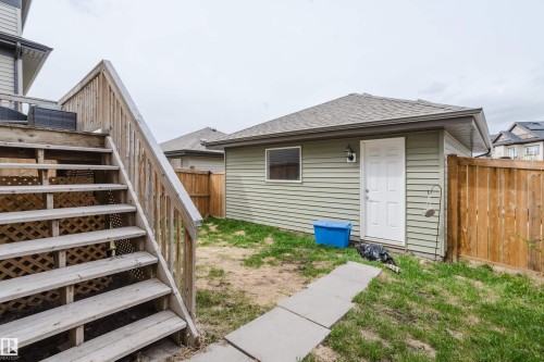 Detached garage with horizontal siding and shingle roofing - 328 West Haven Drive, Leduc, AB - Outdoor With Exterior