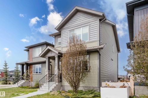 Two-story residence featuring light green and gray horizontal siding - 328 West Haven Drive, Leduc, AB - Outdoor With Facade