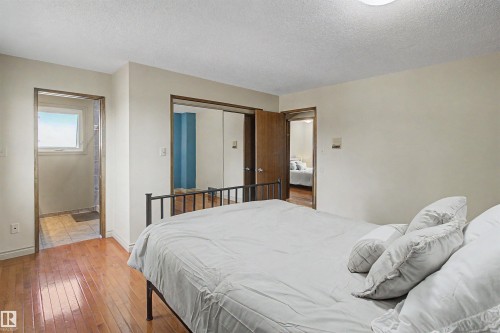 Bedroom featuring wood-finish flooring and neutral wall tones - 11617 26 Avenue, Edmonton, AB - Indoor Photo Showing Bedroom