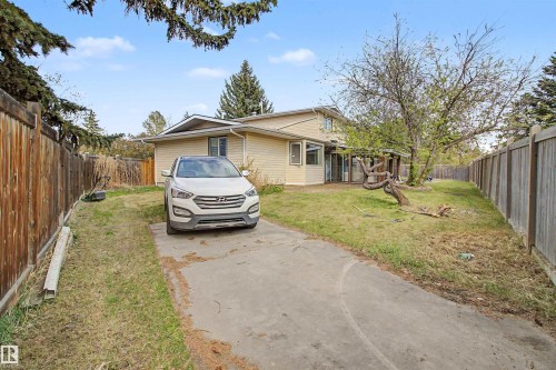 Single-family residence featuring a concrete driveway and light-colored siding - 11617 26 Avenue, Edmonton, AB - Outdoor