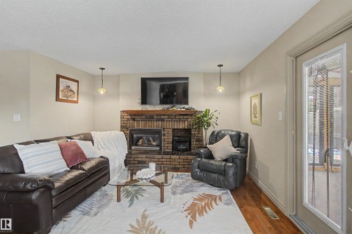 11617 26 Avenue, Edmonton, AB - Indoor Photo Showing Living Room With Fireplace