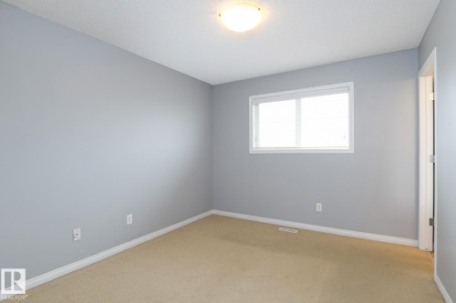 Room featuring light gray walls, white trim, and a neutral carpet - 9071 Scott Crescent, Edmonton, AB - Indoor Photo Showing Other Room