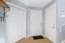 Entryway featuring durable tile flooring, white panel doors, and neutral wall paint - 9071 Scott Crescent, Edmonton, AB  - Indoor Photo Showing Other Room 