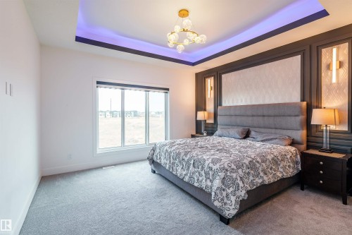 Recessed tray ceiling with accent lighting - 219 28 Street, Edmonton, AB - Indoor Photo Showing Bedroom