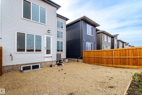 Contemporary exterior with light-colored siding and multiple windows - 219 28 Street, Edmonton, AB - Outdoor With Exterior