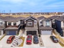 Contemporary two-story residence featuring a dark gray and brown exterior with stone accents - 219 28 Street, Edmonton, AB  - Outdoor With Facade 