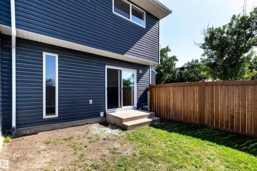 Dark blue horizontal siding exterior with white trim - 547 Dunluce Road, Edmonton, AB - Outdoor With Exterior