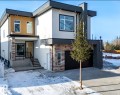 Contemporary facade featuring a prominent flat roofline and dark trim accents - 5820 110 Street, Edmonton, AB  - Outdoor 