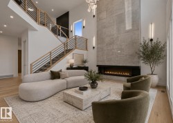 Vaulted ceiling living space featuring light wood-finish flooring - 