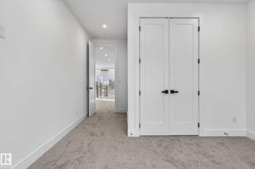 Double panel doors with matte black hardware - 5820 110 Street, Edmonton, AB - Indoor Photo Showing Other Room