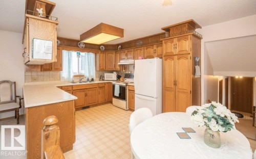 11003 104 Street, Westlock, AB - Indoor Photo Showing Kitchen With Double Sink