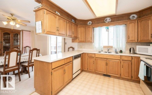 11003 104 Street, Westlock, AB - Indoor Photo Showing Kitchen With Double Sink