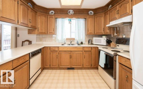 11003 104 Street, Westlock, AB - Indoor Photo Showing Kitchen With Double Sink