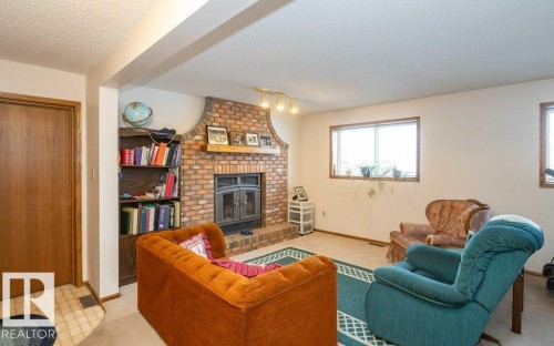 11003 104 Street, Westlock, AB - Indoor Photo Showing Living Room With Fireplace