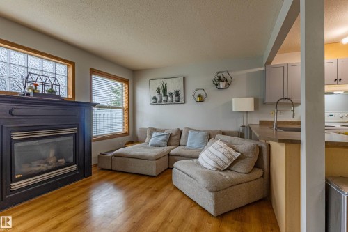 93 16823 84 Street, Edmonton, AB - Indoor Photo Showing Living Room With Fireplace