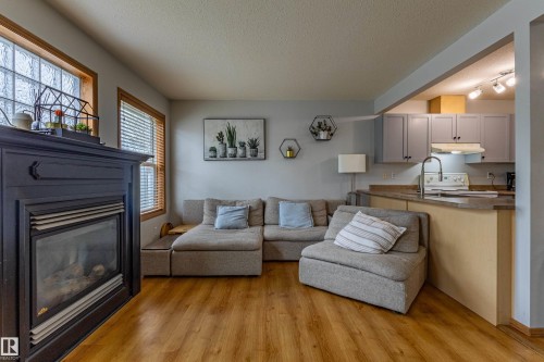 93 16823 84 Street, Edmonton, AB - Indoor Photo Showing Living Room With Fireplace