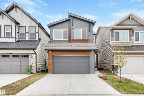 Modern two-story residence featuring a gray and wood-finish facade - 6003 Edmonds Place Nw, Edmonton, AB - Outdoor With Facade