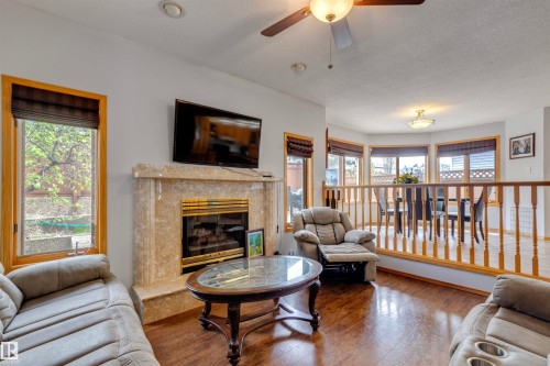 15411 67A Street, Edmonton, AB - Indoor Photo Showing Living Room With Fireplace