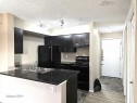 210 3207 James Mowatt Trail, Edmonton, AB  - Indoor Photo Showing Kitchen With Double Sink 