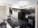 210 3207 James Mowatt Trail, Edmonton, AB  - Indoor Photo Showing Kitchen With Double Sink 